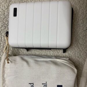 Great for travel or put in your purse. New, never used with little bag.